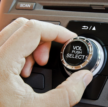 Man using car volume audio.